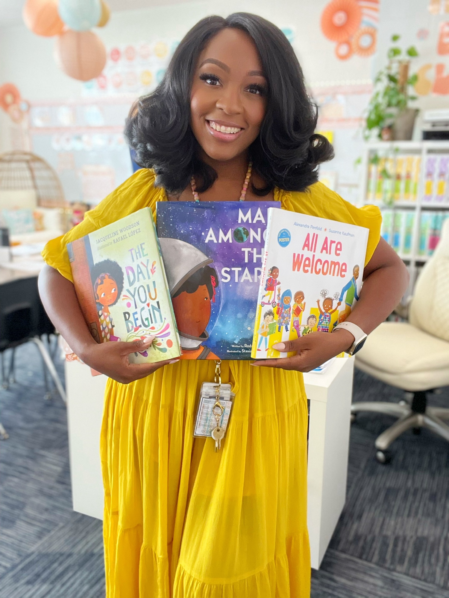 Patrice Jenkins holding picture books in her classroom